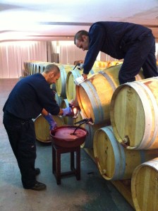 The laborious process of fining the wines.